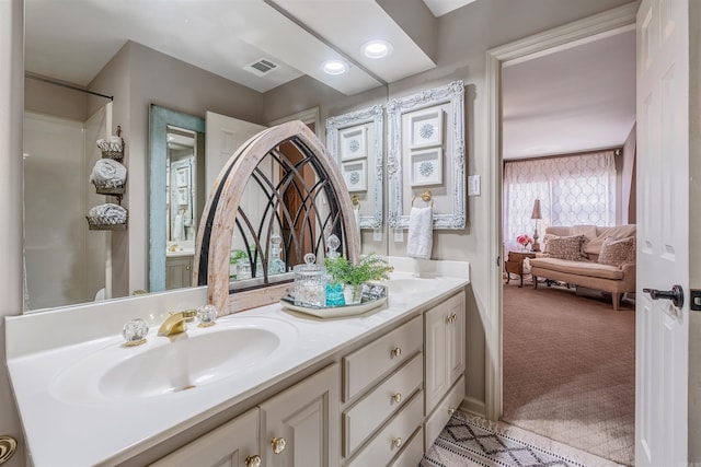 full bath with recessed lighting, visible vents, a sink, and double vanity