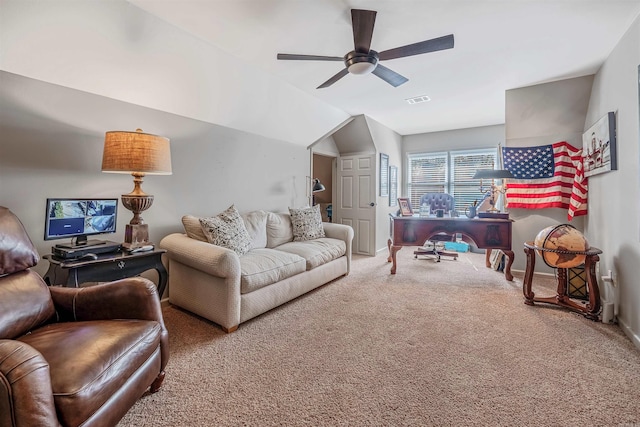 carpeted living area featuring ceiling fan, vaulted ceiling, visible vents, and baseboards