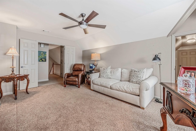 living room with visible vents, baseboards, lofted ceiling, ceiling fan, and carpet