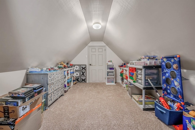 playroom featuring carpet floors and lofted ceiling