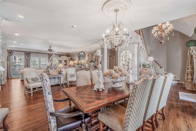 dining room with ornamental molding, wood finished floors, stairs, ceiling fan with notable chandelier, and recessed lighting