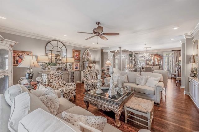 living room featuring recessed lighting, ceiling fan with notable chandelier, ornamental molding, dark wood finished floors, and ornate columns