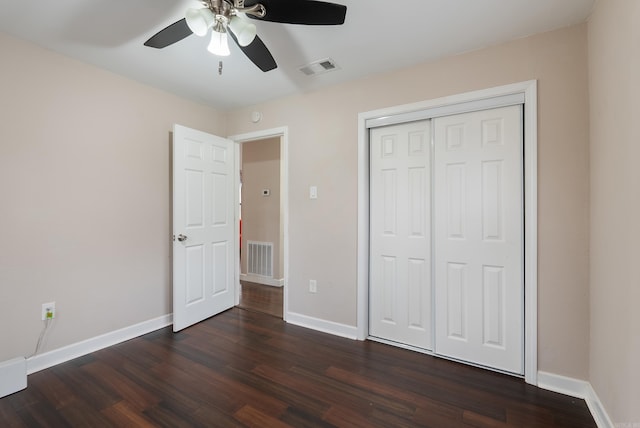 3215 Katherine St, Little Rock, AR 72204 - unfurnished bedroom with dark wood-type flooring, visible vents, baseboards, and a ceiling fan