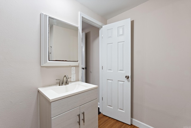 3215 Katherine St, Little Rock, AR 72204 - bathroom with vanity, baseboards, and wood finished floors