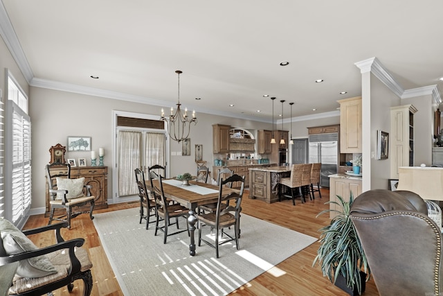 dining area featuring a notable chandelier, crown molding, recessed lighting, and light wood-style floors