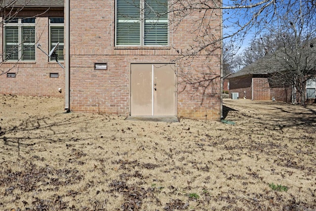 entrance to property with brick siding