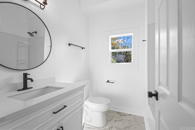 bathroom with marble finish floor, baseboards, vanity, and toilet