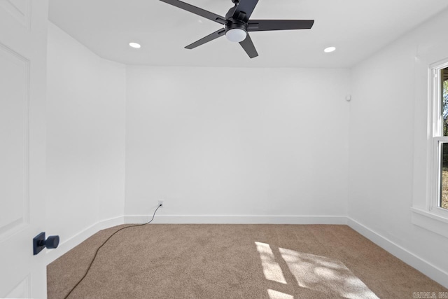 empty room with recessed lighting, carpet, and baseboards