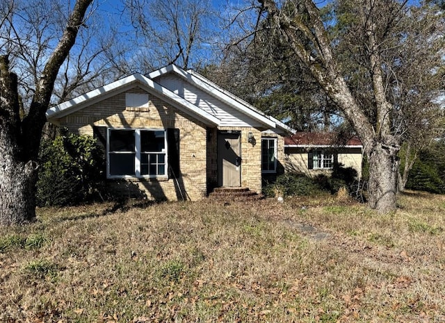 view of front of house featuring brick siding