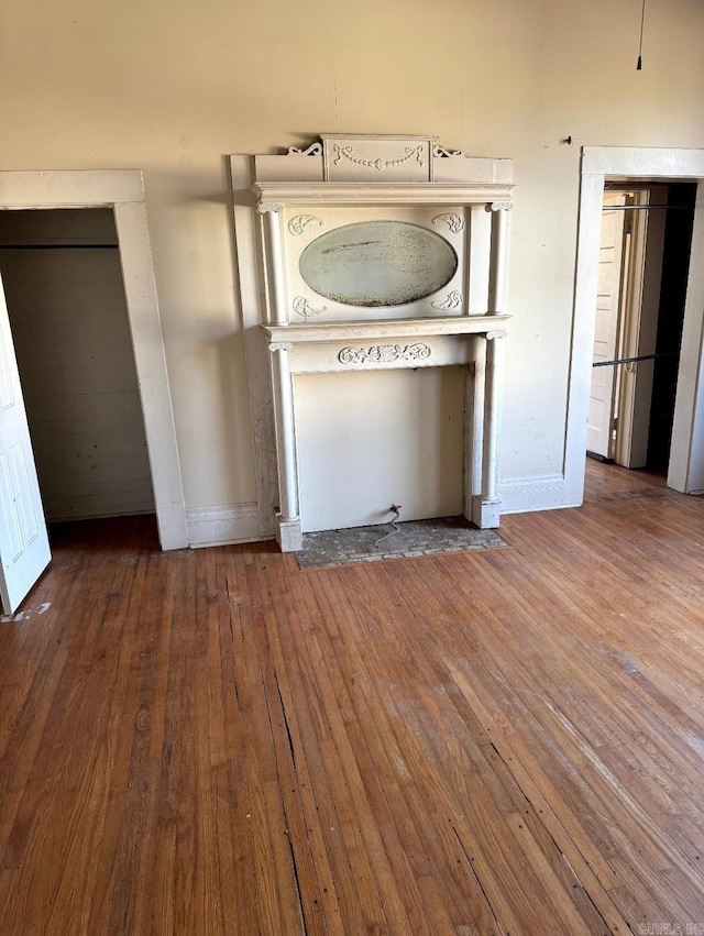 interior space with baseboards and hardwood / wood-style floors