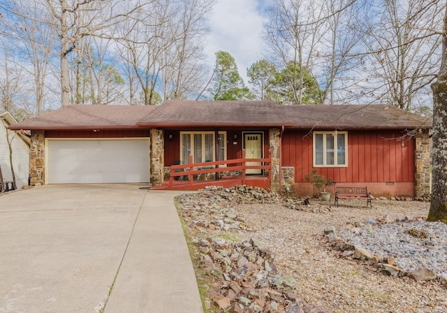 ranch-style home with a porch, board and batten siding, crawl space, a garage, and driveway