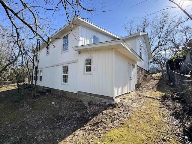 view of property exterior featuring fence