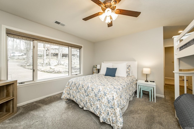 bedroom with a ceiling fan, carpet flooring, visible vents, and baseboards