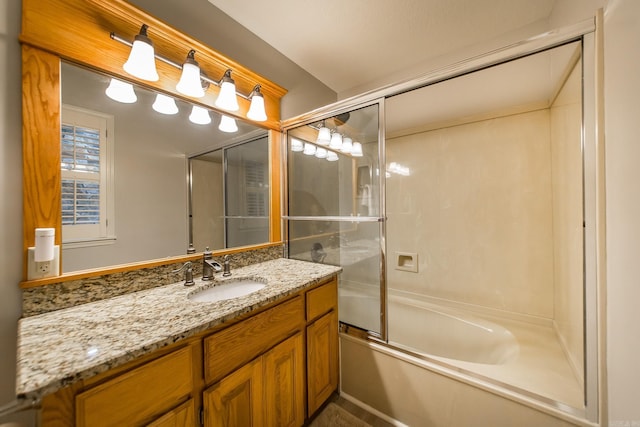 full bath with combined bath / shower with glass door and vanity