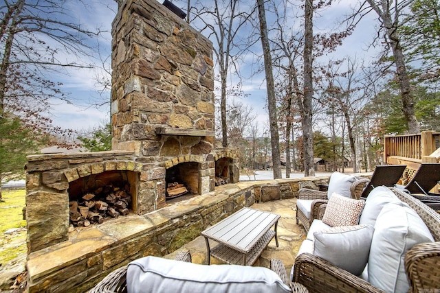 view of patio / terrace featuring an outdoor living space with a fireplace