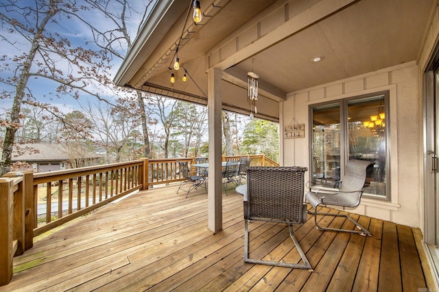 wooden deck with outdoor dining area