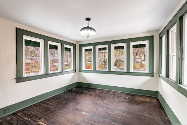 unfurnished sunroom featuring a healthy amount of sunlight