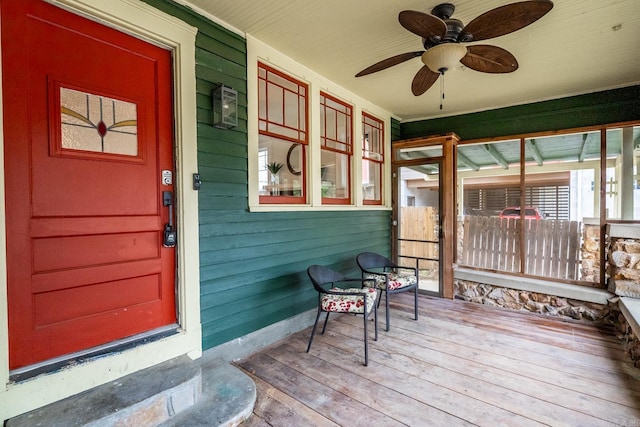 sunroom with a ceiling fan