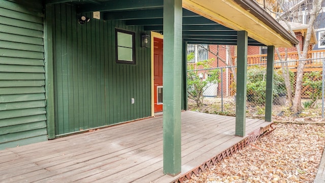 wooden deck featuring fence