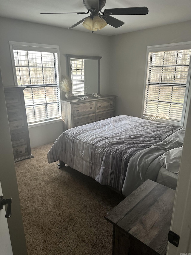 carpeted bedroom featuring ceiling fan