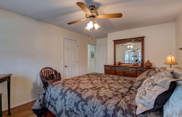 bedroom featuring ceiling fan and wood finished floors