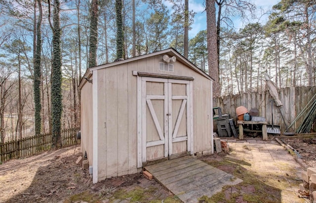 view of shed featuring a fenced backyard