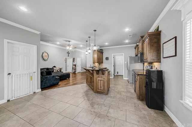 kitchen featuring dark countertops, ceiling fan, open floor plan, crown molding, and backsplash