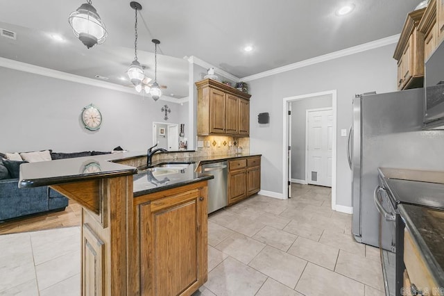 kitchen with brown cabinets, stainless steel appliances, decorative backsplash, open floor plan, and a sink