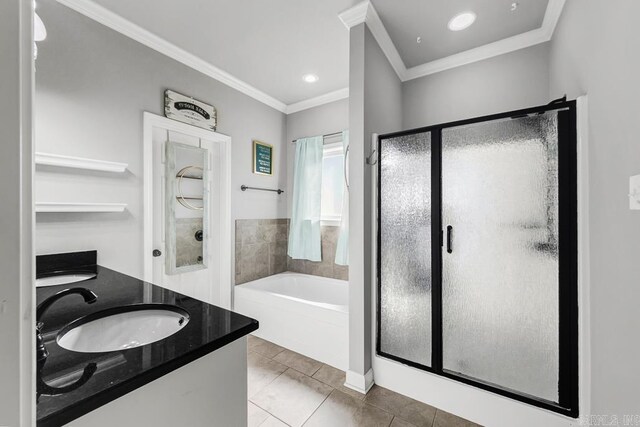 full bath featuring double vanity, a sink, crown molding, a shower stall, and a bath