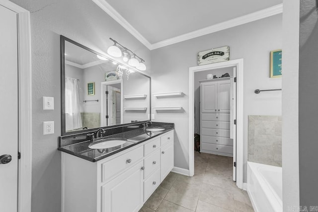 full bath featuring double vanity, tile patterned floors, a sink, and crown molding