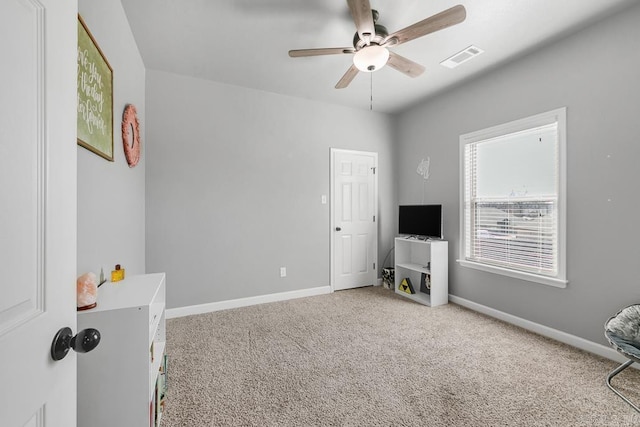 carpeted bedroom with visible vents, ceiling fan, and baseboards
