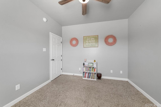 interior space with ceiling fan, baseboards, and carpet flooring