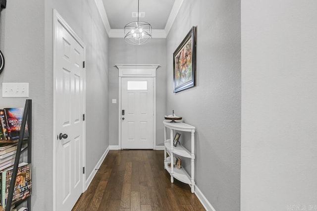 doorway to outside with dark wood-style floors, baseboards, a chandelier, and crown molding