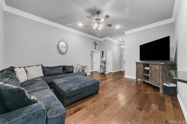 living area featuring crown molding, visible vents, a ceiling fan, wood finished floors, and baseboards