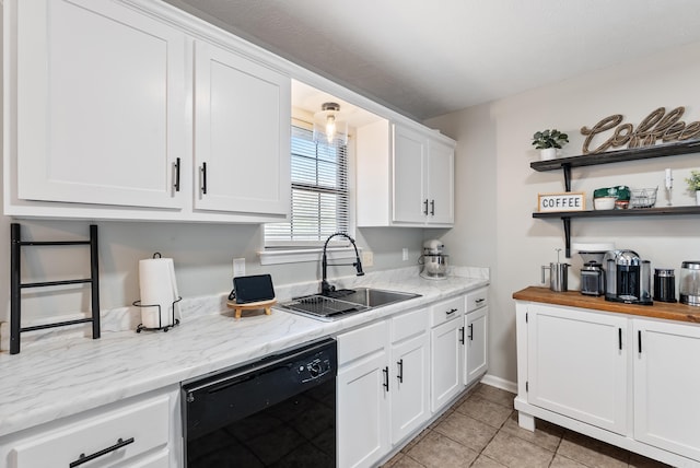 kitchen with light tile patterned floors, black dishwasher, white cabinets, open shelves, and a sink