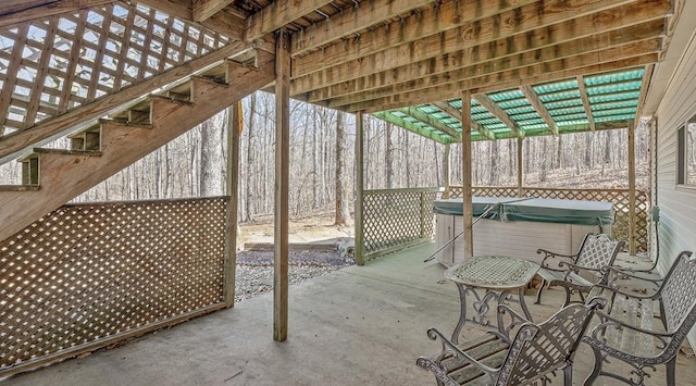 view of patio / terrace with a hot tub