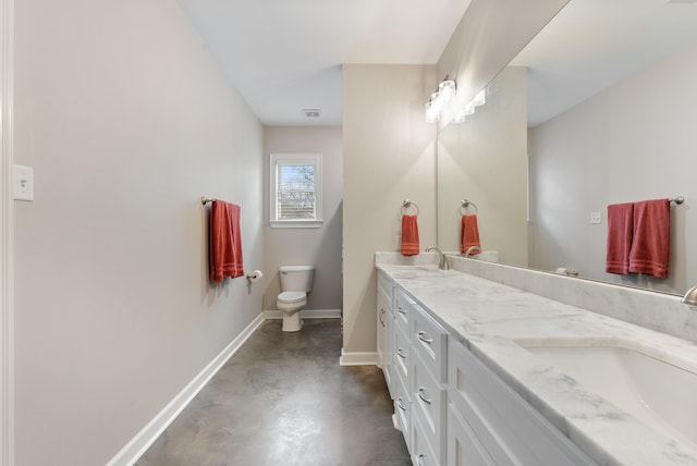 full bathroom with double vanity, baseboards, concrete flooring, and a sink