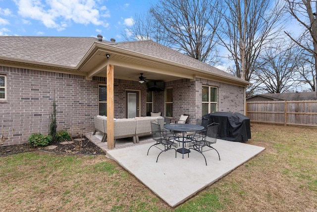 view of patio / terrace with outdoor lounge area, area for grilling, fence, and a ceiling fan