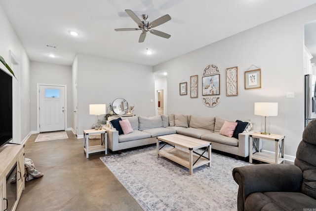 living area featuring concrete flooring, recessed lighting, a ceiling fan, visible vents, and baseboards