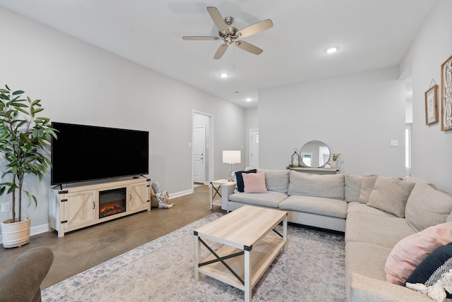 living area featuring finished concrete floors, baseboards, a ceiling fan, and recessed lighting