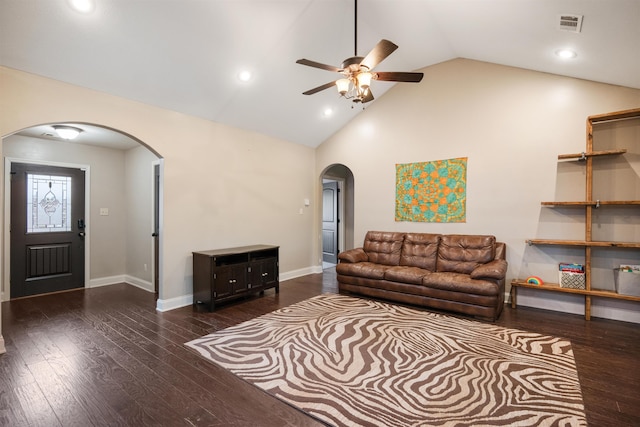 living room featuring baseboards, arched walkways, and wood finished floors