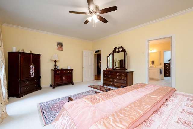 bedroom with ensuite bath, a ceiling fan, crown molding, and light colored carpet