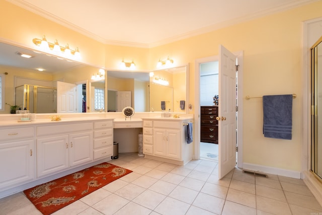 bathroom with tile patterned flooring, vanity, visible vents, a shower stall, and crown molding