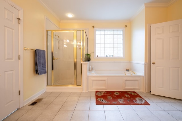 bathroom with tile patterned flooring, visible vents, a bath, and ornamental molding