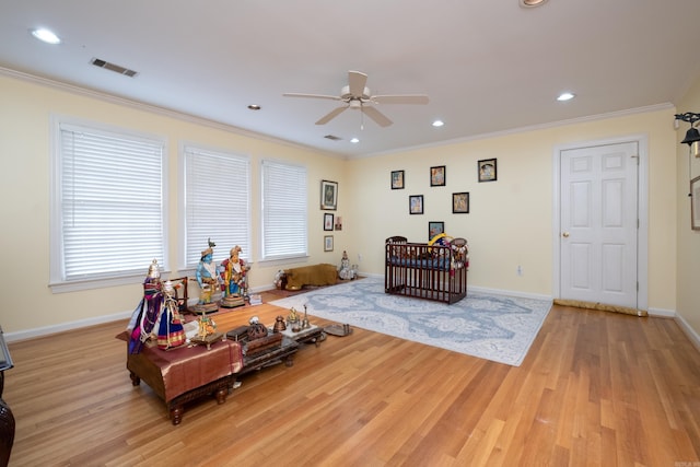 interior space with recessed lighting, visible vents, ornamental molding, light wood-type flooring, and baseboards