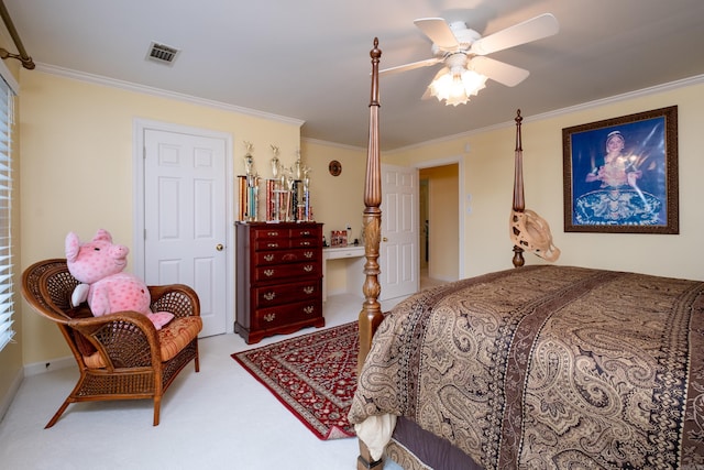 carpeted bedroom with a ceiling fan, visible vents, and crown molding