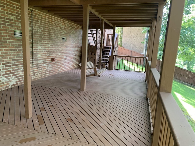 wooden deck with stairway and fence