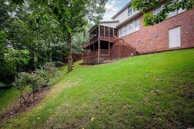 view of yard with stairs and a sunroom