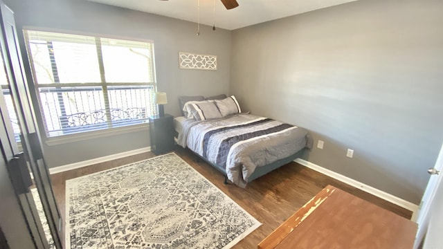 bedroom featuring ceiling fan, wood finished floors, and baseboards