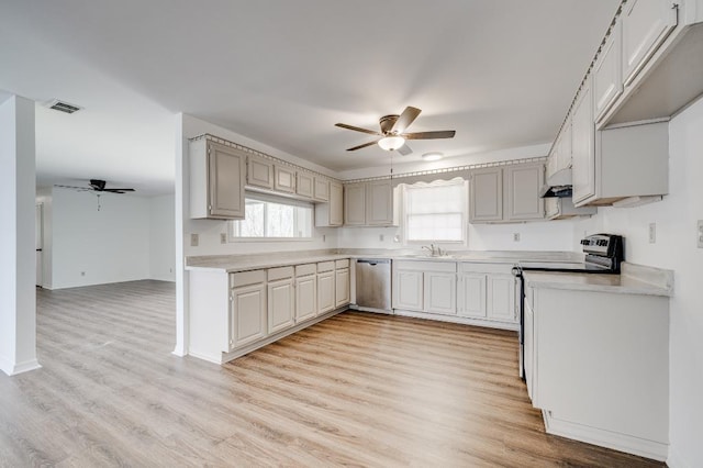 kitchen featuring a healthy amount of sunlight, visible vents, appliances with stainless steel finishes, and a sink